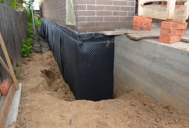 Happy homeowners after waterproofing job in La Center
